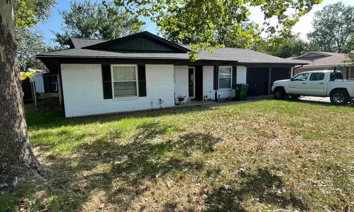 Professional roofing crew working on a residential roof in Mapleton